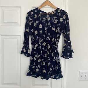 Forever 21 Floral Romper With Bell Sleeves and Plunging Neckline.